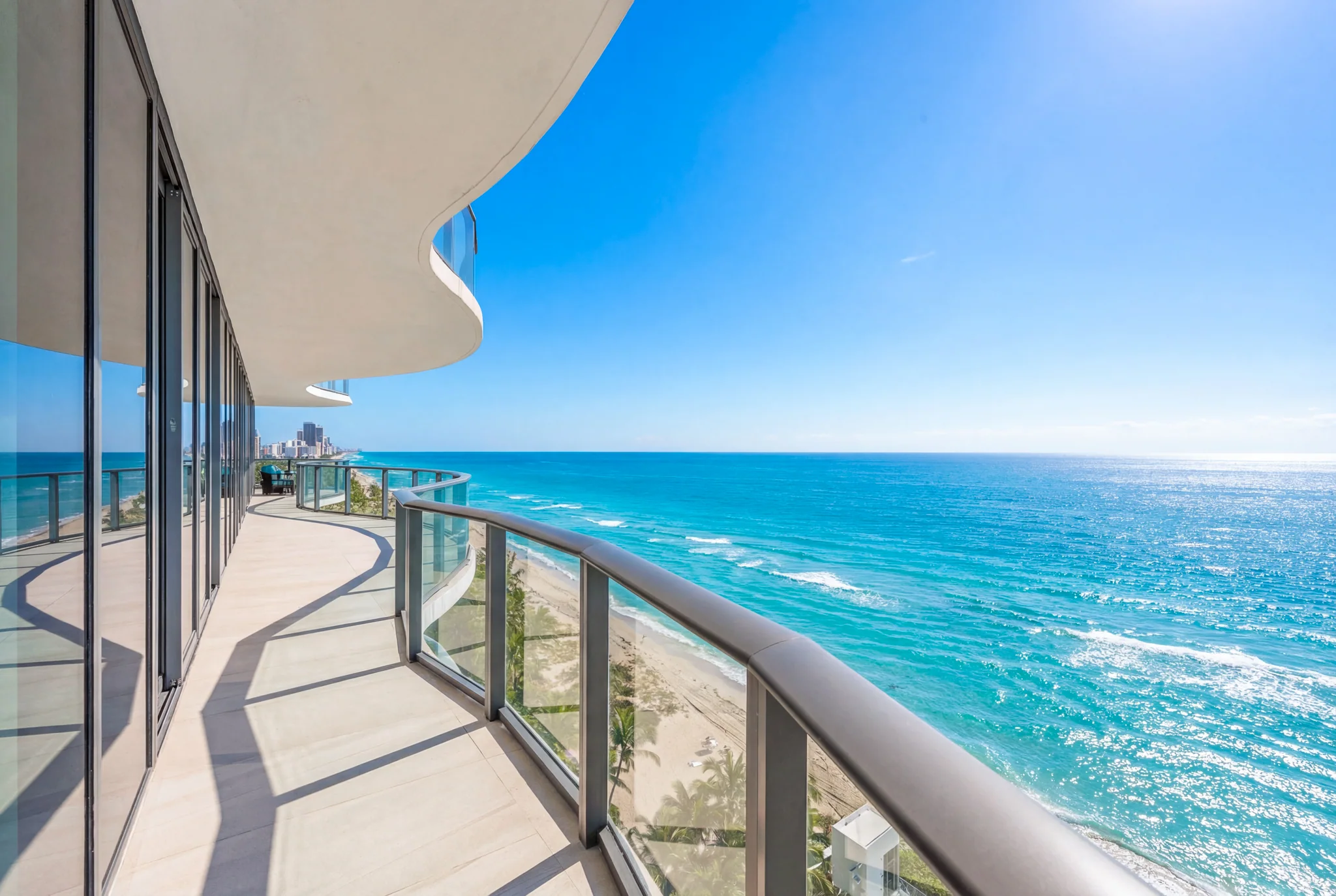 Curved oceanfront terrace overlooking the Atlantic in bright daylight